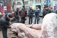 Protesters Chisel at Lenin Statue